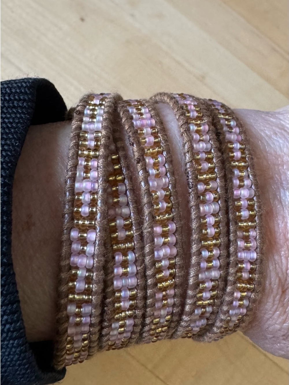 Pink and Gold Beaded Wrap Bracelet with Brown Band and gold and pink beads.